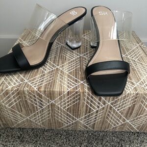 Black sandal with clear heel